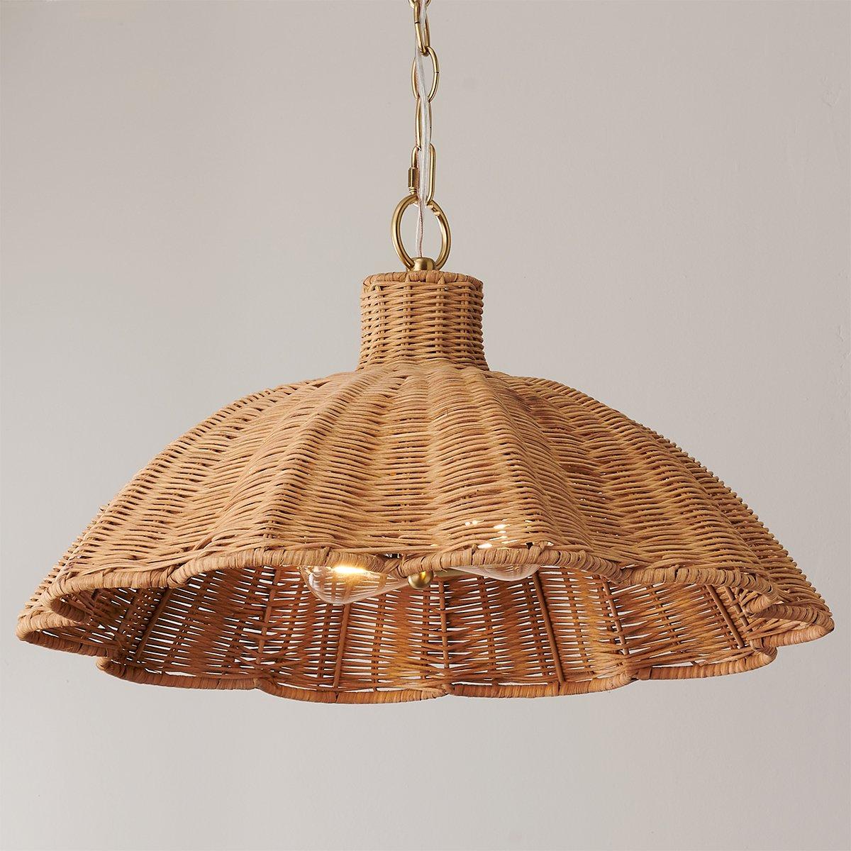 handwoven rattan pendant light with aged brass hardware
