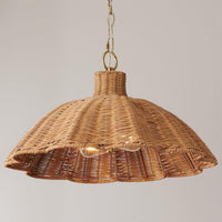 handwoven rattan pendant light with aged brass hardware
