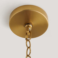 handwoven rattan pendant light with aged brass hardware