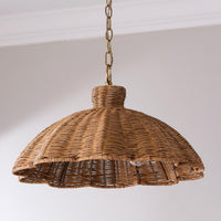 Handwoven rattan pendant light with aged brass hardware