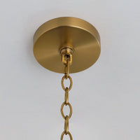 Handwoven rattan pendant light with aged brass hardware
