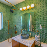 Lyra Aged Brass Globe Vanity Sconce