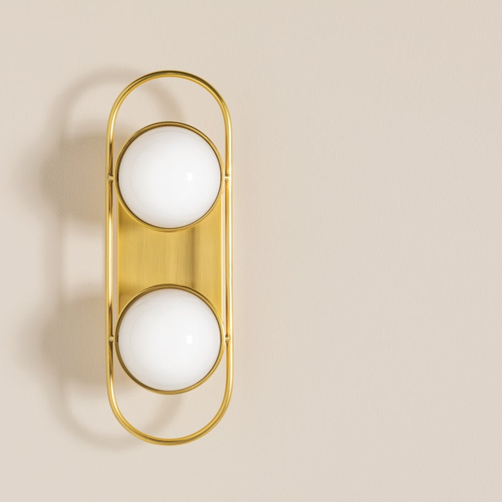 Lyra Aged Brass Globe Vanity Sconce